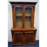 A VICTORIAN WALNUT GLAZED DOUBLE BOOKCASE, on a married base with two drawers, width 121cm x depth