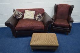 A MODERN BROWN LEATHER STUDDED AND UPHOLSTERED TWO PIECE LOUNGE SUITE, comprising a winged