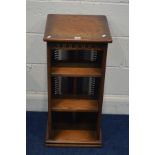 A MELLOWCRAFT OAK REVOLVING BOOKCASE, with a CD rack and open shelves, 37cm square x height 76cm