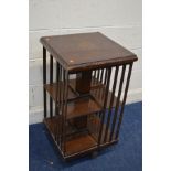 A 20TH CENTURY BURR WALNUT REVOLVING BOOKCASE with inlay to top, 47cm square x height 85cm (some