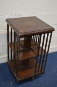 A 20TH CENTURY BURR WALNUT REVOLVING BOOKCASE with inlay to top, 47cm square x height 85cm (some