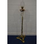 AN EARLY 20TH CENTURY ART NOUVEAU BRASS TELESCOPIC OIL LAMP, with a shaped etched glass shade,