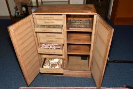 A MID 20TH CENTURY LINED OAK COLLECTORS CABINET, containing trays and drawers of shells, fossils and