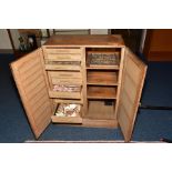 A MID 20TH CENTURY LINED OAK COLLECTORS CABINET, containing trays and drawers of shells, fossils and