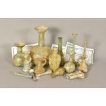 AN INTERESTING COLLECTION OF ANCIENT ROMAN GLASS, including unguentarium vessels, perfume bottle and