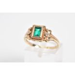 AN EMERALD AND DIAMOND RING, designed with a central rectangle cut emerald within a collet mount and