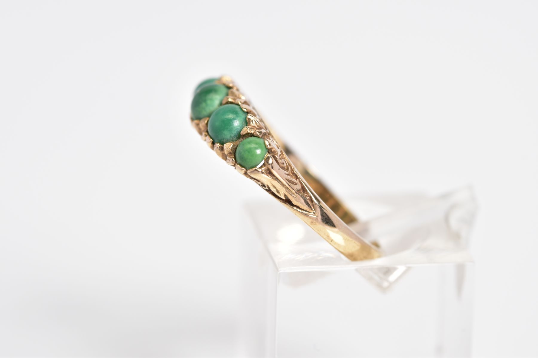 AN EARLY 20TH CENTURY 9CT GOLD RING, set with five graduated circular cut cabochon turquoise, within - Image 2 of 3