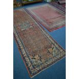 A 20TH CENTURY HERIZ ORANGE AND BLUE GROUND CARPET RUNNER, 440cm x 140cm (some low pile) together