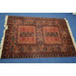A 20TH CENTURY LOUIS DE POORTERE RED GROUND MILAS STYLE GROUND RUG, with geometric multi strap
