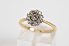 A DIAMOND CLUSTER RING, the yellow metal ring set with a central old cut diamond and a single cut