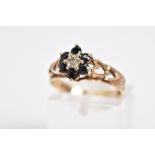 A 9CT GOLD SAPPHIRE AND DIAMOND CLUSTER RING, the cluster set with a single cut diamond within a