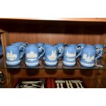 A SET OF FIFTEEN BOXED PALE BLUE WEDGWOOD CHRISTMAS MUGS 1971-1985, decorated with Royal Palaces and
