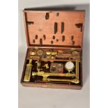 AN EARLY 19TH CENTURY BRASS TRAVELLING MICROSCOPE AND ACCESSORIES BY BANKS OF 441 STRAND, LONDON, in