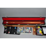 AN INTERSPORT CLUB TWO PIECE CUE, in a hard case, a Malibu two piece cue in a soft case, both in