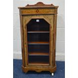 AN EDWARDIAN BURR WALNUT PIER CABINET with geometric stringing to top, the canted front corners