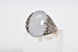 A MOONSTONE CABOCHON RING, the yellow metal ring designed with an oval cut cabochon moonstone,