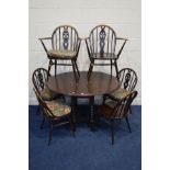 A SET OF SIX DARK ERCOL ASH AND BEECH DINING CHAIRS, including two carvers, together with an oak