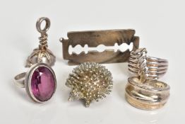 A SELECTION OF ITEMS, to include a silver pendant in the form of a blade, with a silver hallmark for