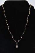 A MODERN DIAMOND CENTREPIECE NECKLET, consisting of yellow and white alternating wave polished panel