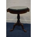 A MODERN MAHOGANY DRUM TABLE with pie crust edge covered with glass, two frieze drawers, turned