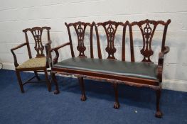A 20TH CENTURY CHIPPENDALE STYLE THREE SEATER SOFA with a heavily carved mahogany frame, with