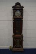 A LATE 19TH CENTURY OAK POLYPHON LONGCASE CLOCK, arched and scrolled pediment above a moulded