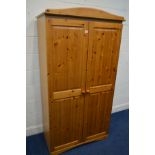 A MODERN PINE TWO DOOR WARDROBE, width 97cm x depth 54cm x height 183cm