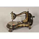 A LATE VICTORIAN JONES & CO SERPENTINE DESIGN FREESTANDING SEWING MACHINE, patent no 46034, gilt