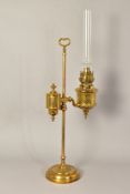 A LATE 19TH/EARLY 20TH CENTURY FRENCH BRASS OIL LAMP, on a height adjustable column with carrying