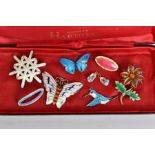 EIGHT PIECES OF ENAMELLED SILVER JEWELLERY IN A NORMAN HARTNELL CASE, including a white snowflake