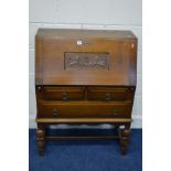 A MID 20TH CENTURY OAK FALL FRONT BUREAU, with three drawers, on acorn and bulbous front legs united
