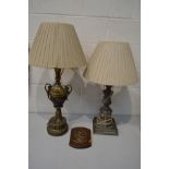 A BRASSED AND EBONISED GREEK STYLE TABLE LAMP with a shade, height to fitting 70cm, together with