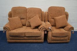 AN ORANGE UPHOLSTERED TWO PIECE LOUNGE SUITE, comprising a two seater settee and an armchair (2)