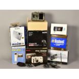 A TRAY CONTAINING VARIOUS BOXED CAMERAS, including Sanyo, Flip Video, Bushnells, Samsung, Sony, etc