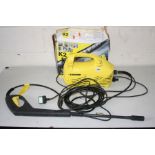 A KARCHER 140 PRESSURE WASHER with attachment in original box (PAT pass and working)