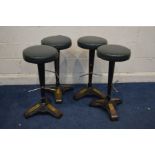 A SET OF FOUR MODERN ART DECO STYLE CAST IRON BAR STOOLS with brassed feet on a triangular section