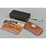 TWO PAIRS OF RAY-BAN GLASSES, both of out doorsmandesign, the first with a gold coloured frame and