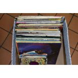 A BOX CONTAINING OVER FORTY LP'S AND 7'' SINGLES, including Billy Joel, Lionel Richie, Nat King Cole