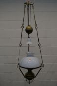 AN EARLY 20TH CENTURY BRASS RISE AND FALL CEILING OIL LAMP, with glass shades and funnel, diameter