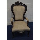 A LARGE ELABORATELY CARVED VICTORIAN MAHOGANY ARMCHAIR with foliate detail to the shaped back,