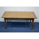 A REPRODUCTION GOLDEN OAK RECTANGULAR COFFEE TABLE on a jointed base with square tapering legs,