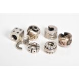 A COLLECTION OF SIX PANDORA CHARMS, to include a dice, letter C initial set with colourless paste,