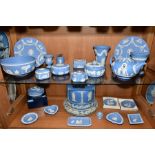 A GROUP OF WEDGWOOD LIGHT BLUE JASPERWARES, to include teapot, vases (tallest height 15cm), bowl,