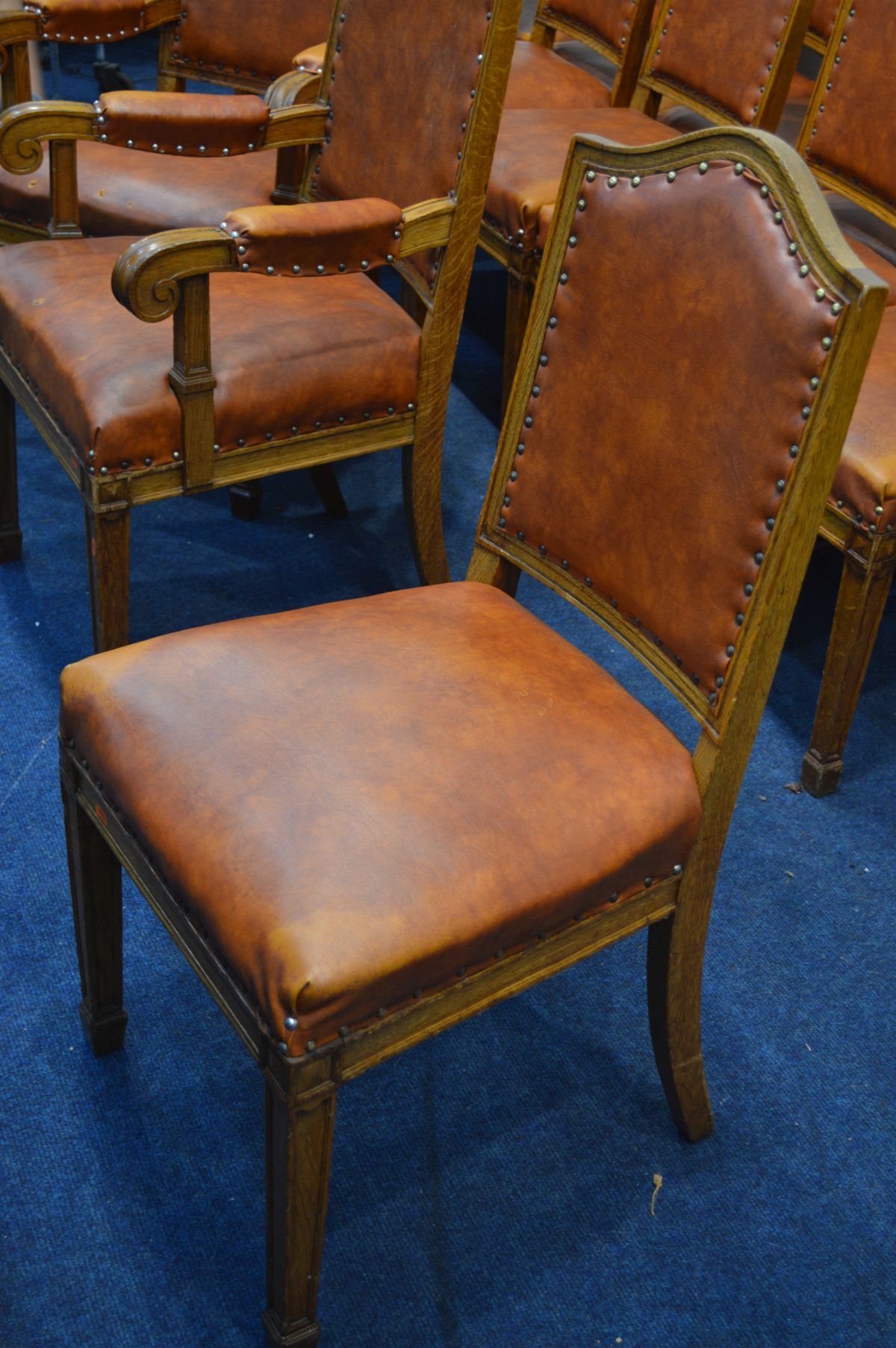 A SET OF FIFTEEN EARLY 20TH CENTURY OAK BOARDROOM CHAIRS including two carver chairs with light - Image 3 of 3