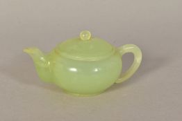 A SMALL CHINESE GREEN HARDSTONE TEAPOT, with loop handle, height 5cm (chip to rim)