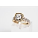 A 9CT GOLD CUBIC ZIRCONIA SET RING, designed with a raised central square panel set with a