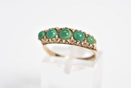 AN EARLY 20TH CENTURY 9CT GOLD RING, set with five graduated circular cut cabochon turquoise, within