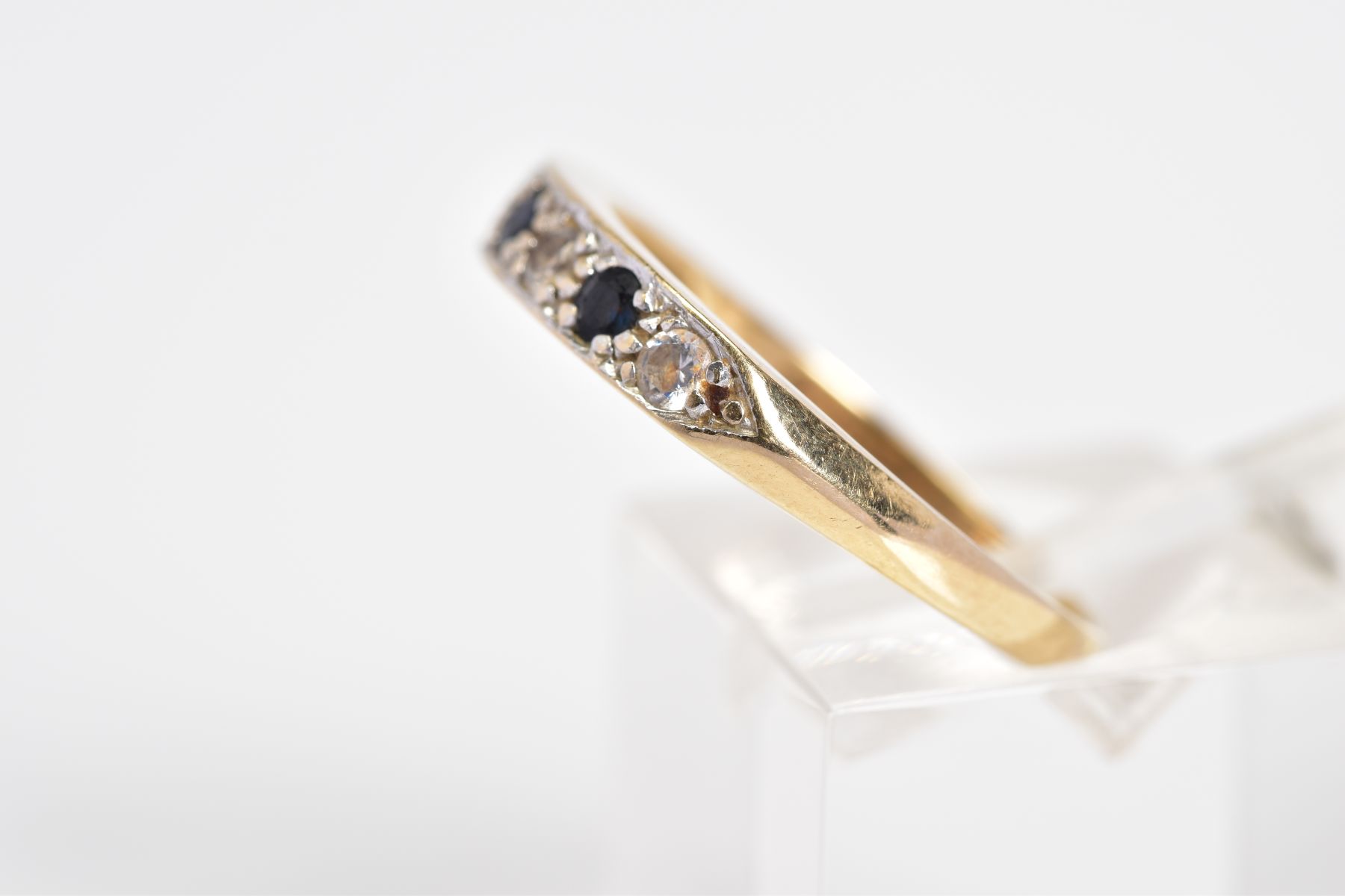 A 9CT GOLD HALF ETERNITY RING, set with three circular cut sapphires interspaced with four - Image 2 of 3