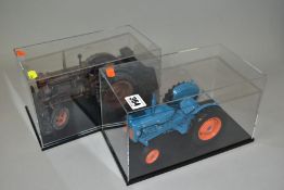 TWO UNBOXED UNIVERSAL HOBBIES FORDSON TRACTOR MODELS, 1/16 scale and contained in display