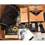 A NIKON COOLPIX P90, with box, software and cables, a boxed Coolpix S01, two Nikon leather cases,